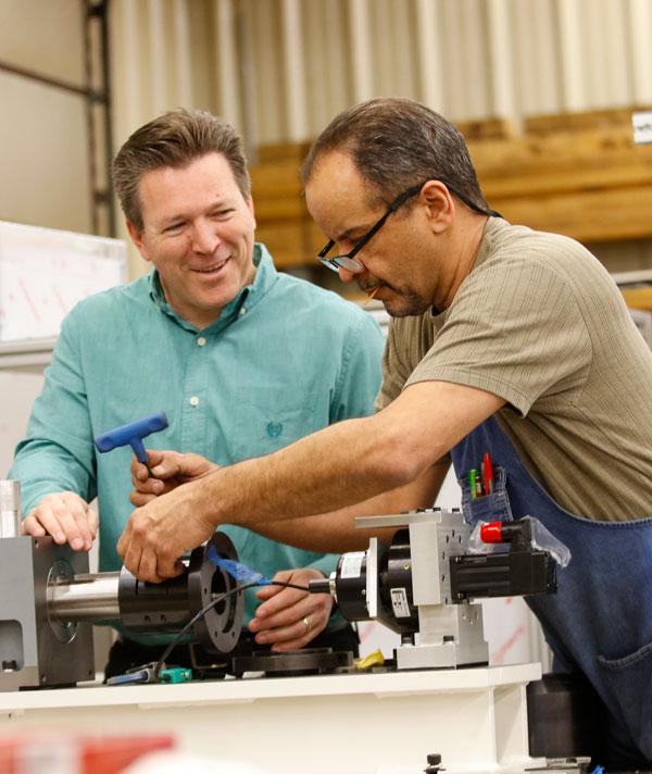 ADS engineers working on an automated assembly system
